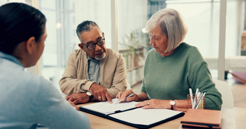 A couple review the concept of discount for lack of marketability with their financial advisor.